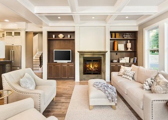 Cozy living room with fireplace, built-in shelves, and comfortable seating